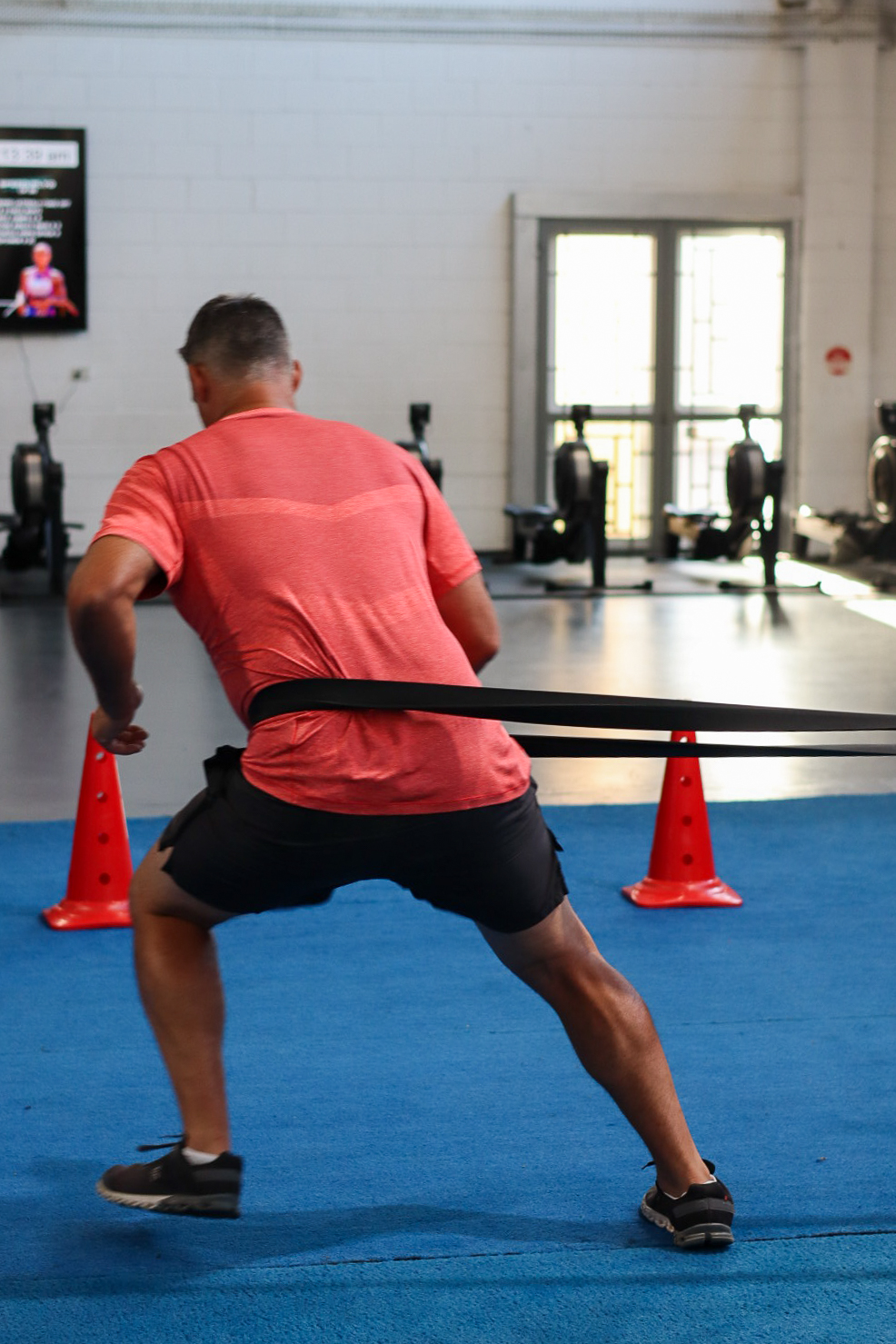 Conditioning work on the blue turf — movement, agility, breath.